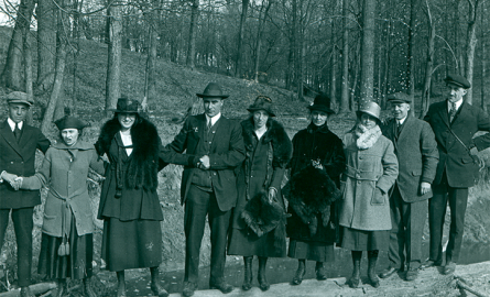 People standing outside in winter clothing.
