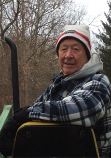 Man sitting on tractor.