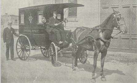 Grey and white image with horse and buggy.