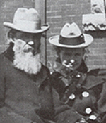 Black and white image of a man and women standing next to each other.