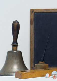 A bell, marbles and a few other objects. 