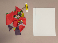 scrap paper on a table with diagram and glue stick